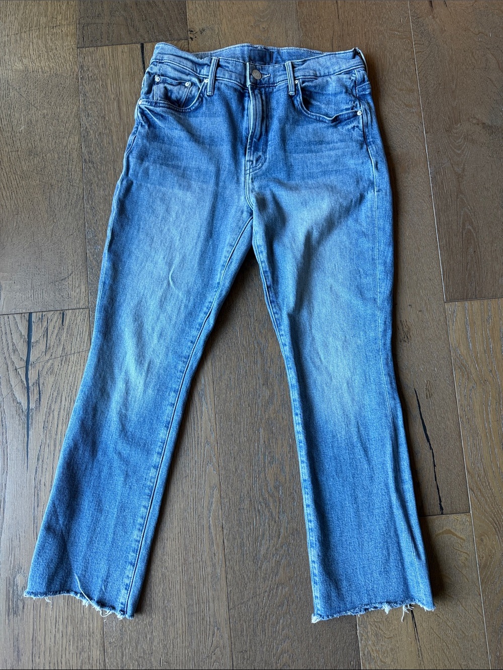 MOTHER Cropped Light Blue Denim Jeans with Raw Hem